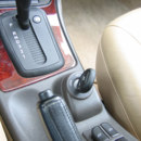 Which car manufacturer puts the ignition switch between the seats?